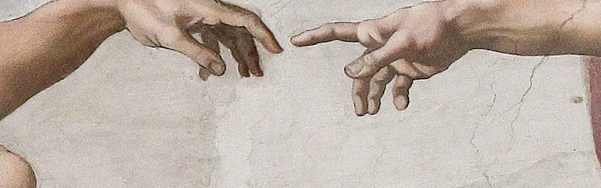Le mani di Dio e di Adamo che quasi si toccano, dettaglio della Creazione di Adamo di Michelangelo nella Cappella Sistina